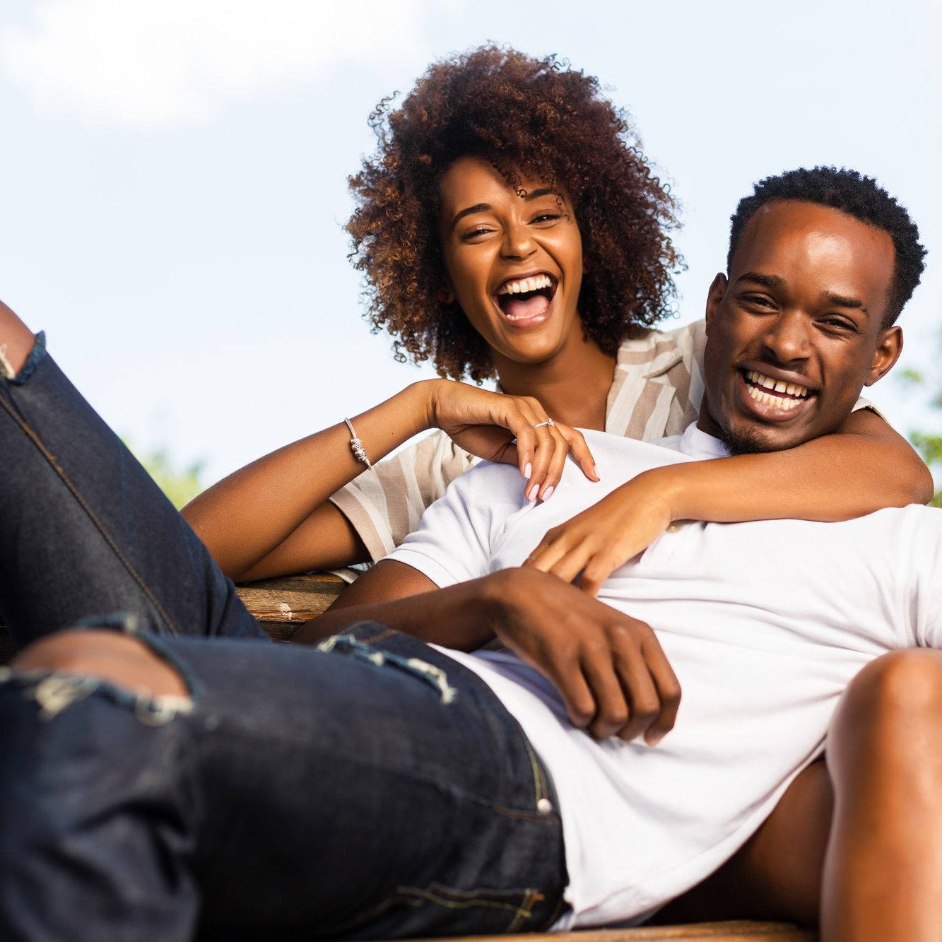 Outdoor protrait of black african american couple embracing each